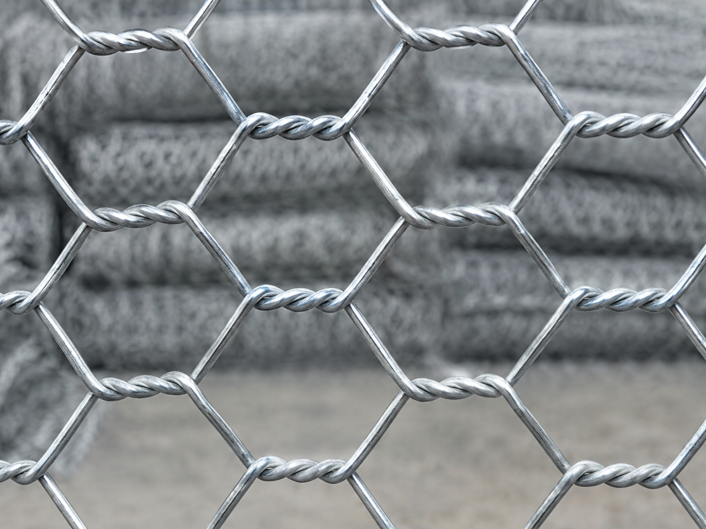 Close-up of gabion mesh wire showing the double-twist hexagonal pattern